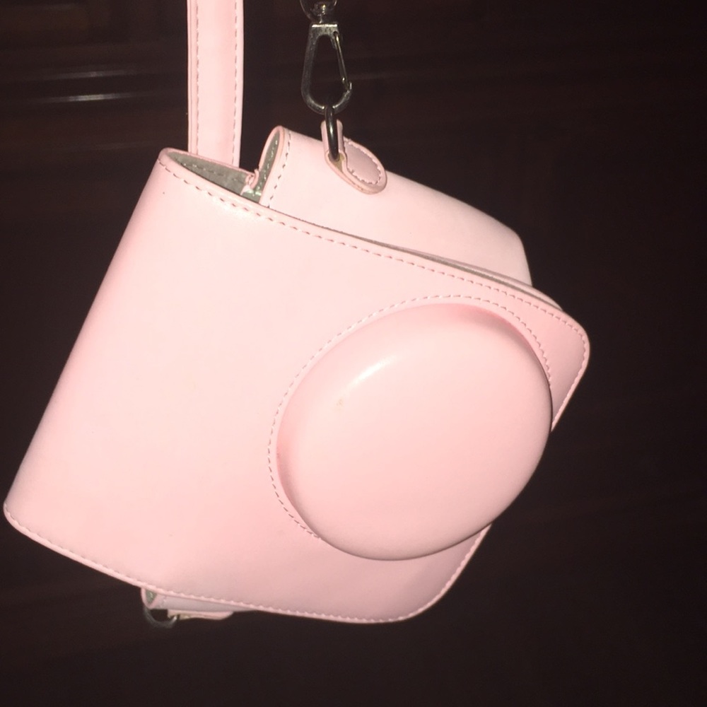 It’s a camera case. For a polaroid camera